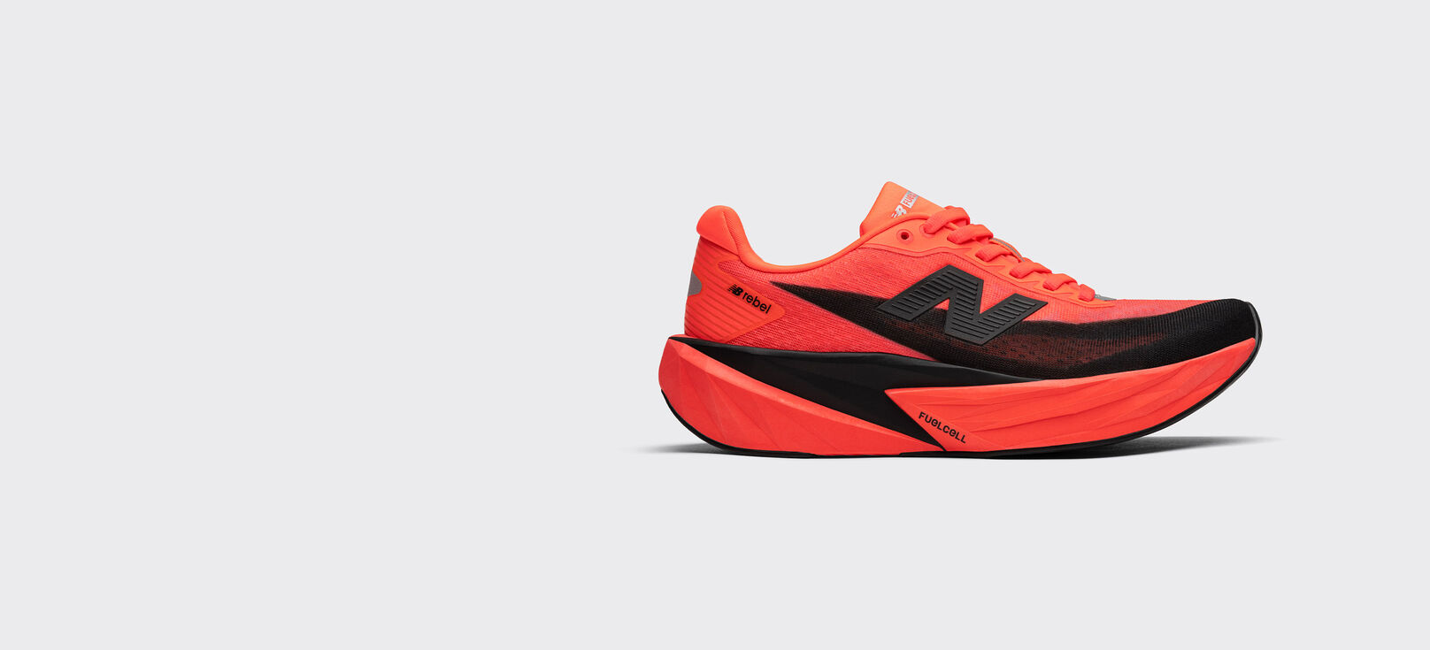 Side view of the FuelCell Rebel v5 in urgent red and black 