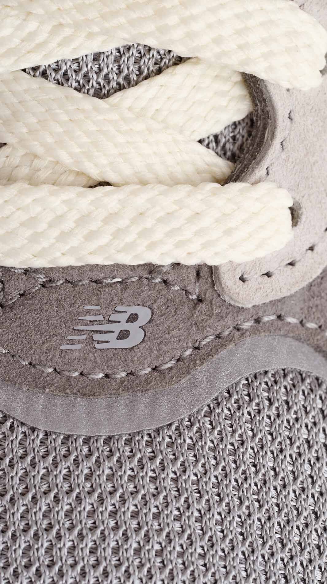A close up detail shot of the material of the 990v7 sneaker.