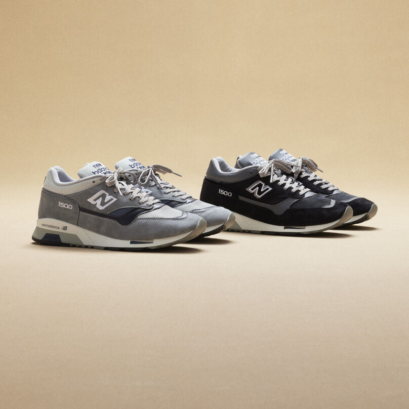 2 New Balance Made in UK sneakers sitting next to each other in a beige studio environment.